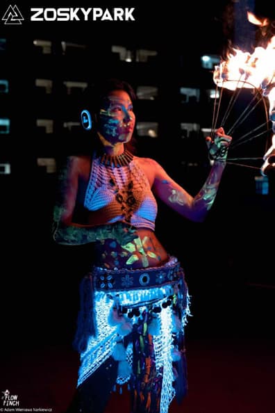 A UV-lit fire and movement performer.